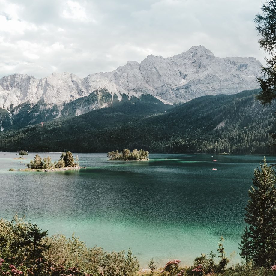 The turquoise Eibsee with the Zugspitze massif rising behind it